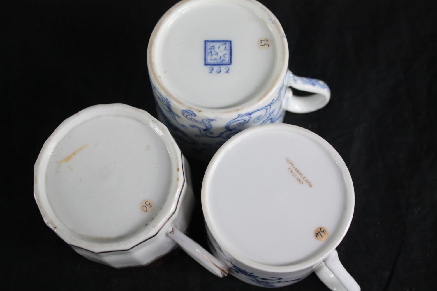 An assortment of 19th century porcelain coffee cans with hand painted design, including one made - Image 4 of 4