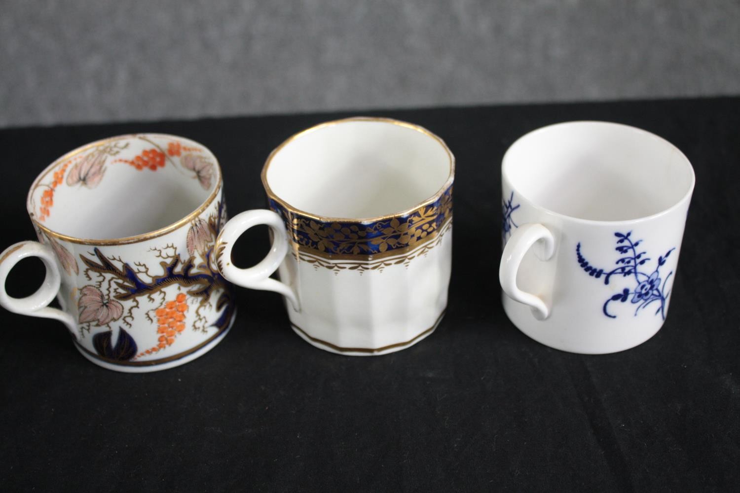 An assortment of 19th century porcelain coffee cans with hand painted design, including one made - Image 2 of 4