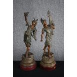 Two bronze effect spelter figures. A patinated allegory of War and Peace. On wooden bases. H.58cm (