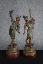 Two bronze effect spelter figures. A patinated allegory of War and Peace. On wooden bases. H.58cm (