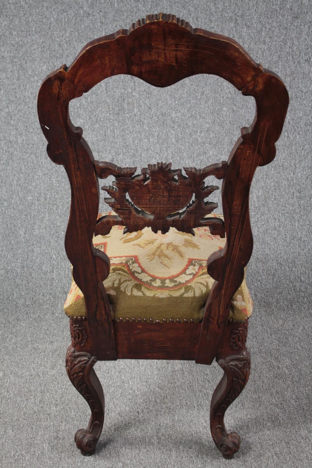 An Eastern carved hardwood side chair. H.118cm. - Image 4 of 6