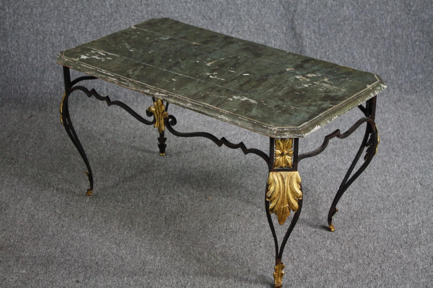 A vintage wrought iron framed coffee table with distressed painted faux marble top. H.50 W.90 D. - Image 4 of 5