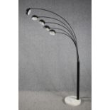 A modern floor lamp with five arms of lights and a marble base. H.198cm.