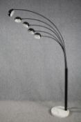 A modern floor lamp with five arms of lights and a marble base. H.198cm.