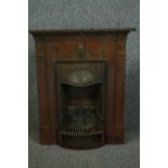 A Victorian cast iron fireplace and hearth with laurel swag detailing. H.105 W.86cm.