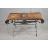 A French conservatory or coffee table, wicker on a scrolling metal frame. H.51 W.103 D.50cm.