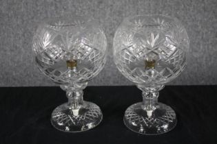 A pair of cut glass lamps. H.27cm (each)