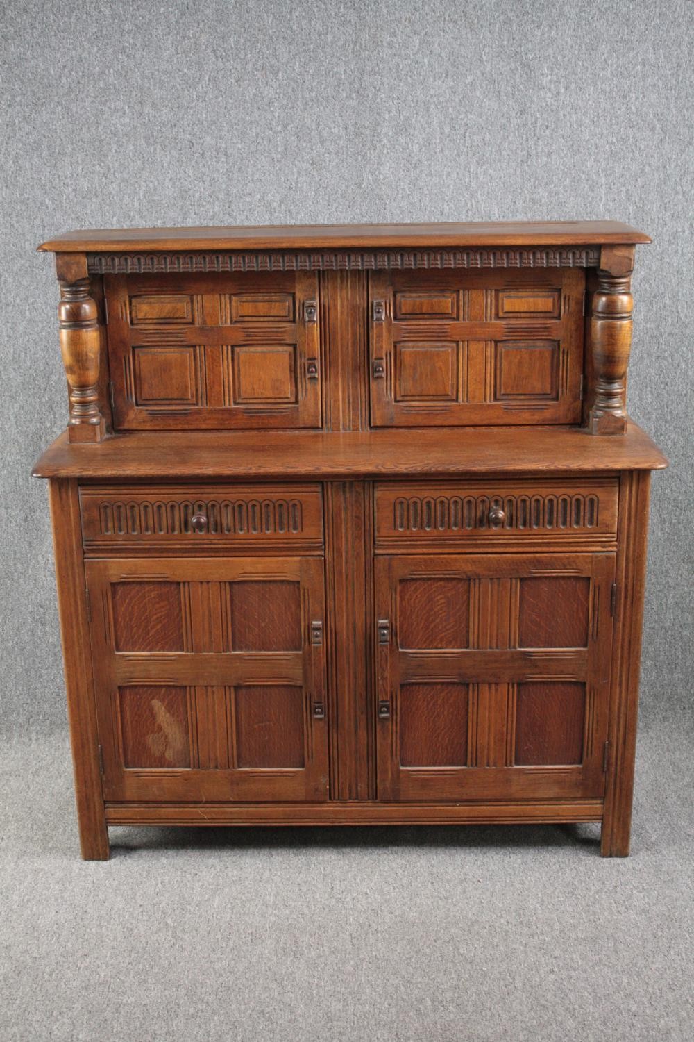 Court cupboard, mid century Jacobean style oak. H.125 W.120 D.46vm.