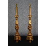 Two wooden table lamps. Finish in gold paint. H.75cm. (each).