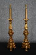 Two wooden table lamps. Finish in gold paint. H.75cm. (each).