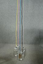 A ceiling light made up of a cluster of jam jars with coloured cable. L.147cm.