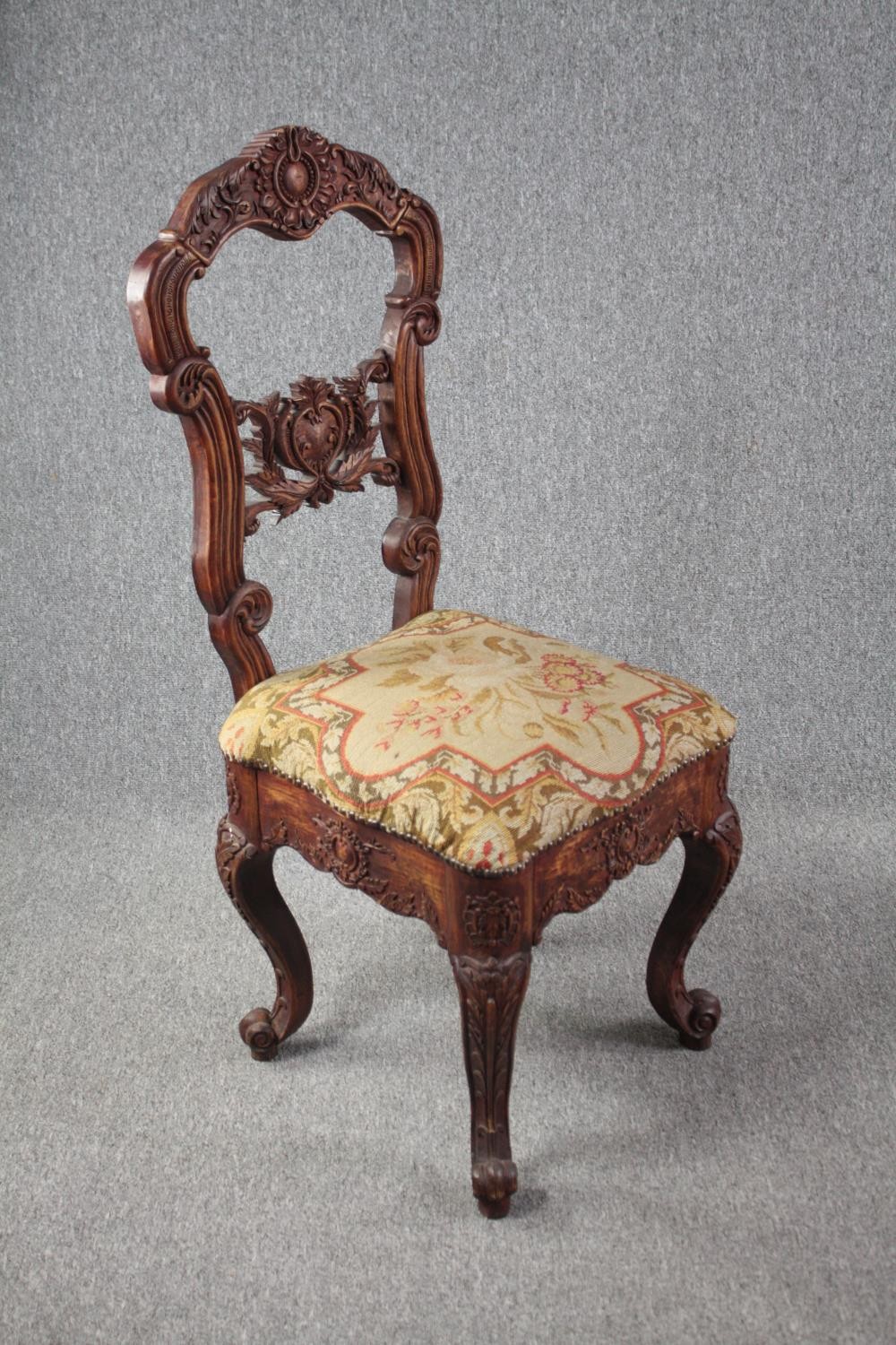 An Eastern carved hardwood side chair. H.118cm. - Image 2 of 6