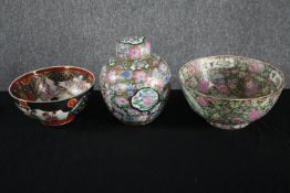 Two twentieth century Japanese Imari bowls and a lidded jar. Dia.31cm. (largest)