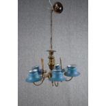 A five branch brass chandelier with light blue toleware shades. H.34 Dia.55cm.