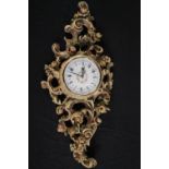 A reproduction Louis XV clock. H.82 W.35cm.