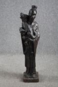 A large figurine. A Chinese man holding a Foo dog. Concrete painted in a bronze like patina. Very