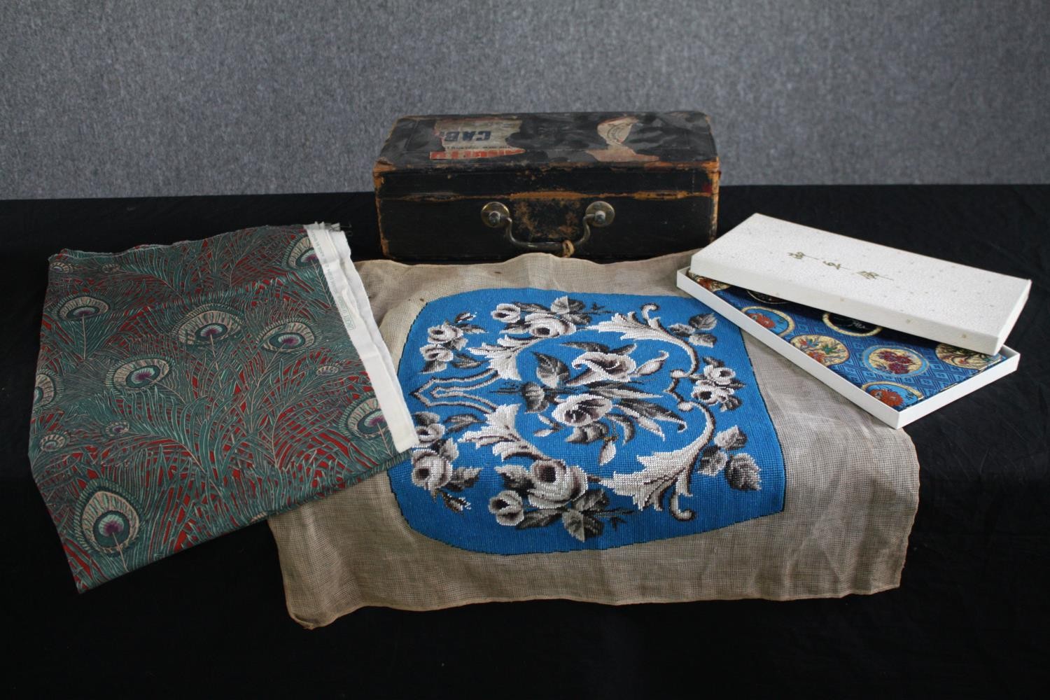 A mixed collection made up of a Liberty Hera feather fabric, a Wickwar & Co. Victorian black leather