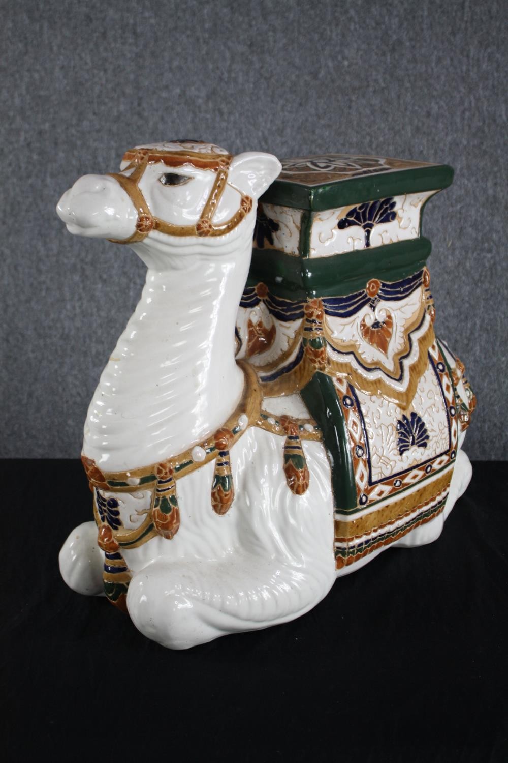 A modern oriental style ceramic Camel garden stool. Hand painted and well detailed. H.49cm. - Image 2 of 4