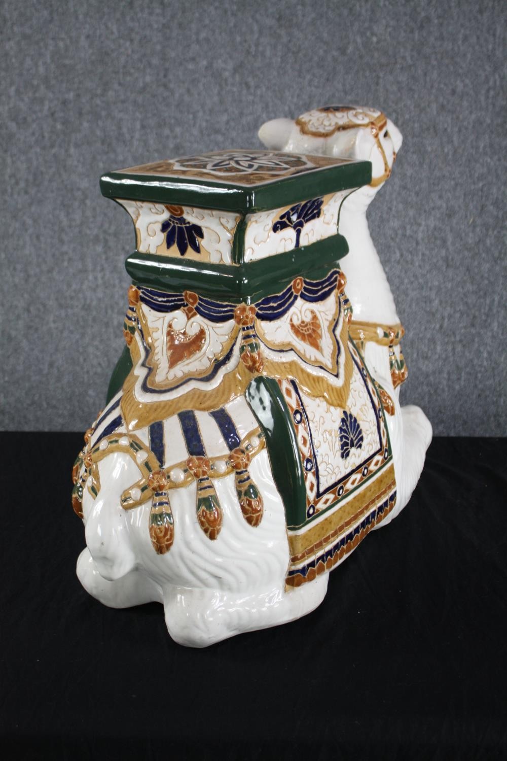 A modern oriental style ceramic Camel garden stool. Hand painted and well detailed. H.49cm. - Image 4 of 4