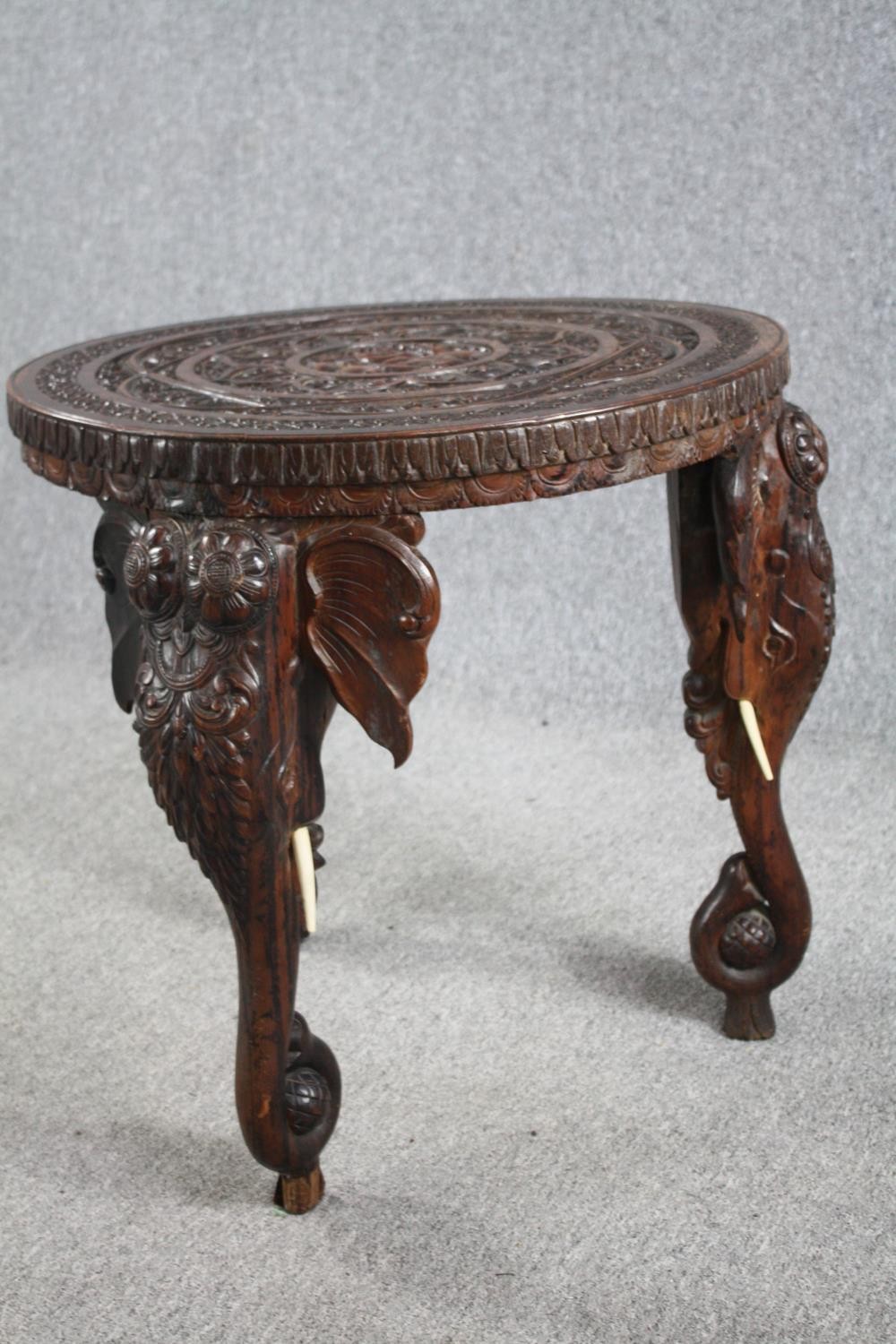 Lamp or occasional table, eastern carved hardwood with elephant supports and bone tusks. H.62 Dia. - Image 4 of 5
