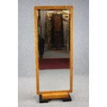 Dressing mirror, Biedermeier burr maple full height with bevelled plate on later block feet. H.161
