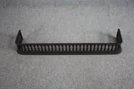 A cast iron pierced foliate design fender. L.110 W.23cm.