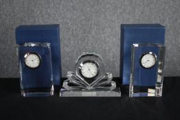 A collection of three Windermere table clocks set in crystal glass. Two are still in their packaging