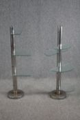 A pair of Art deco display stands with semi circle glass shelves. With six tiers of adjustable