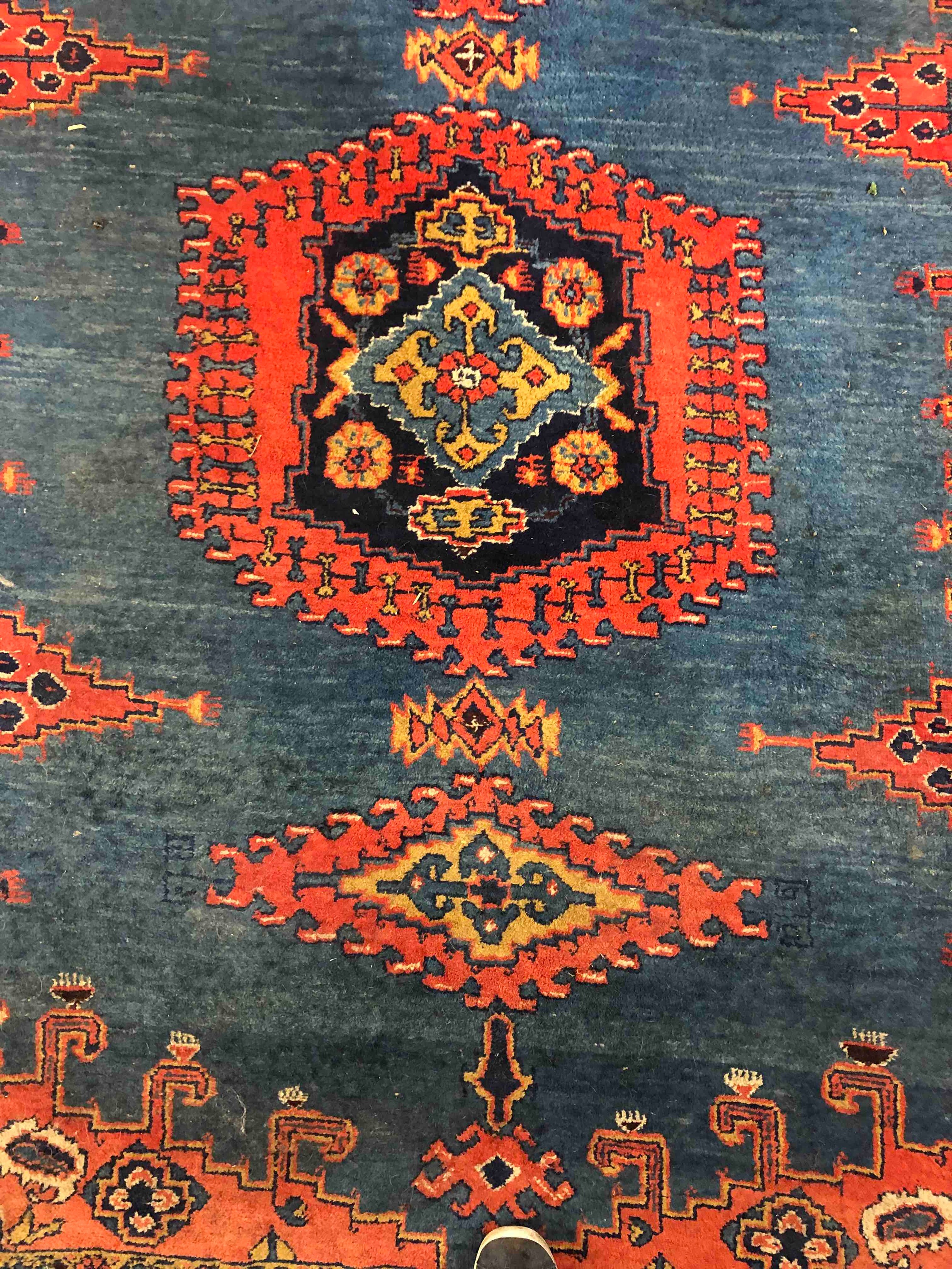 A Persian handmade Senneh rug with geometric designs, dominated by red on a dark blue ground. L. - Image 2 of 3