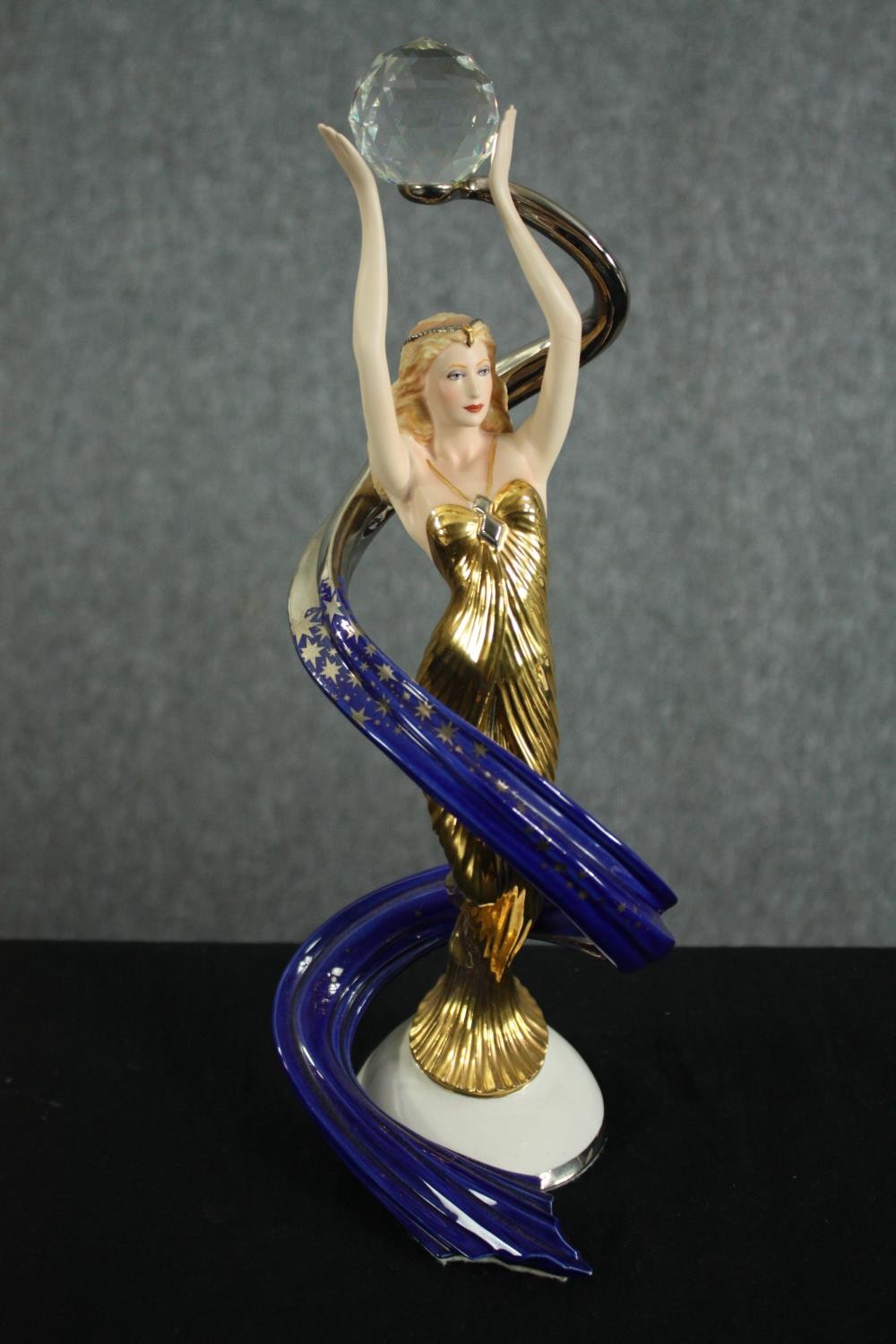 Franklin Mint. Porcelain figurine. Galaxy in Gold. H.36cm.