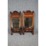 A pair of late 19th century walnut, wall mirrors. H.66 W.29cm. (each)