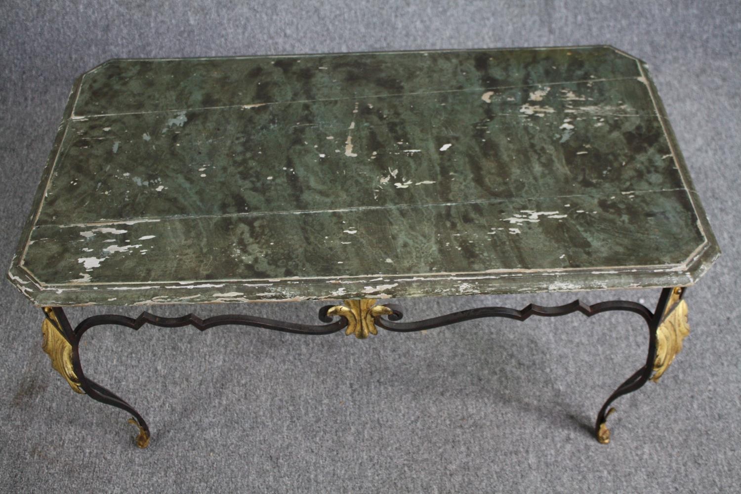 A vintage wrought iron framed coffee table with distressed painted faux marble top. H.50 W.90 D. - Image 2 of 5