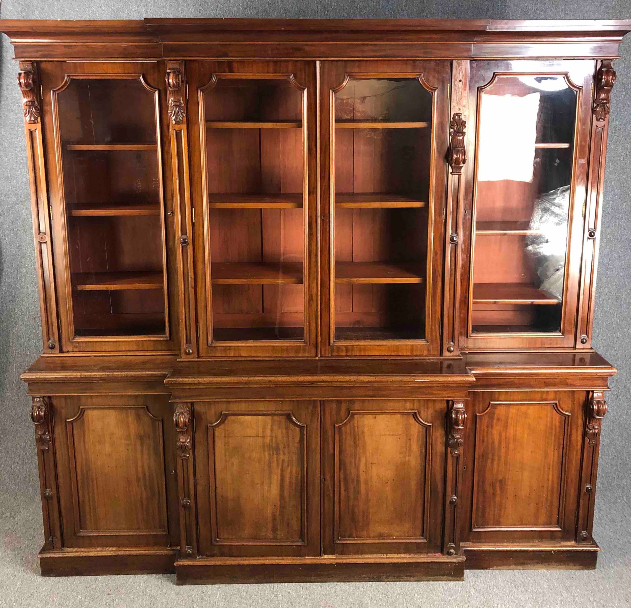 A mid 19th century mahogany breakfront library bookcase. H.234 W.242 D.48cm. (Comes in four sections