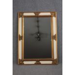 A large contemporary 19th century continental style wall mirror in gilt and painted frame. H.116 W.