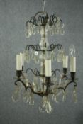 Early 20th century chandelier with five branches of lights and four tiers of hanging glass. H.54cm.