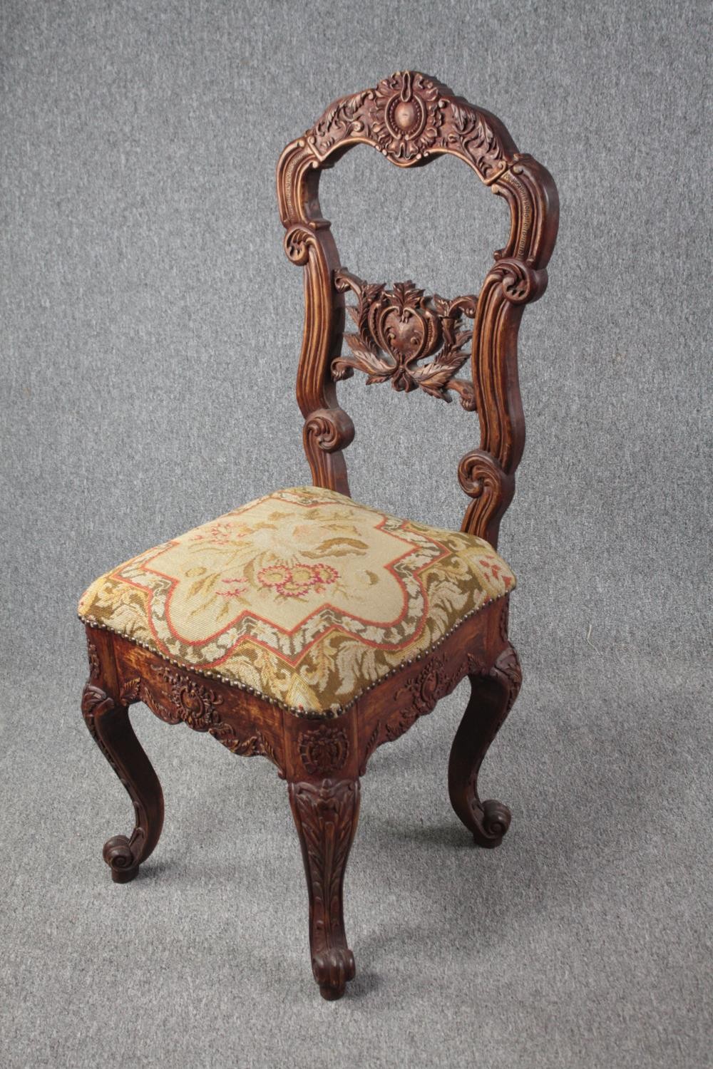 An Eastern carved hardwood side chair. H.118cm. - Image 3 of 6