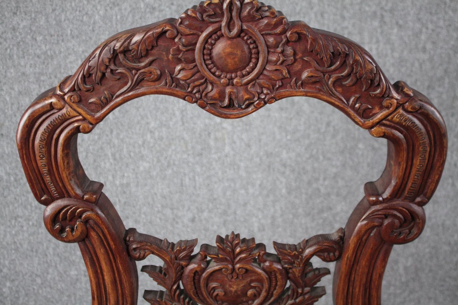 An Eastern carved hardwood side chair. H.118cm. - Image 6 of 6