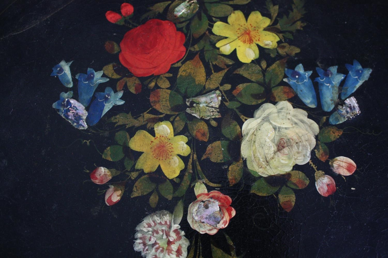 A twentieth century lacquered paper mache tray with floral decoration supported by an iron stand. - Image 5 of 6