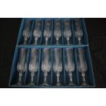 A boxed set of twelve longchamp crystal glasses made by Cristal d'Arques, Paris. H.21cm. (each)