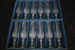 A boxed set of twelve longchamp crystal glasses made by Cristal d'Arques, Paris. H.21cm. (each)