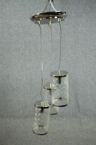 Chrome ceiling light. Three hanging bulbs with glass shades. H.79cm.