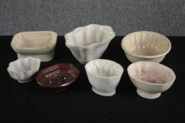 A collection of seven Edwardian jelly fruit moulds. H.10 W.19cm. (largest)