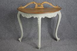 A carved and painted console table on slender cabriole supports. H.88 W.90 D.42cm.