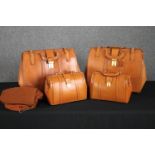 Two pairs of bespoke tan leather Gladstone bag style travel luggage. One larger and one smaller.