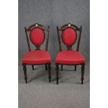 Chairs, a pair, late 19th century amboyna and ebonised with hand painted porcelain medaillon to