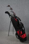 A mixed bag of golf clubs in a Wilson bag. H.88cm. (Qty 17 + bag).