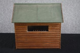 An intricately and well scaled miniature shed. A salesman's model or maybe a toy. Hand made with a