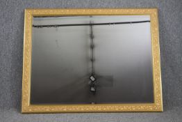 Wall mirror, contemporary in foliate gilt frame. H.97 W.136cm.