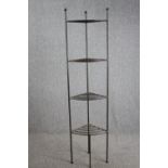 A full height wrought metal pot stand. H.186cm.