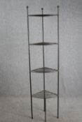 A full height wrought metal pot stand. H.186cm.
